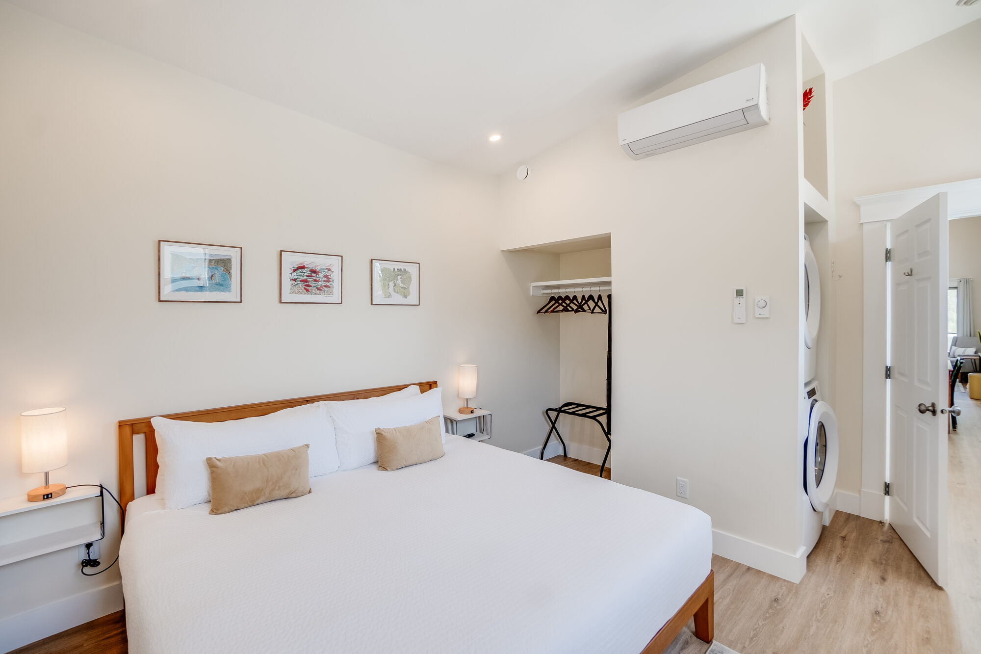 Hotel suite, private bedroom with link bed and in-suite laundry